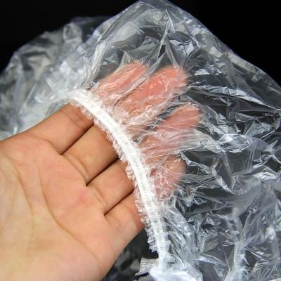 China Hair Salon Disposable Plastic Clear Hotel Spa Hat 100pcs Unique Bathing Shower Bathroom Products Elastic Bath for sale