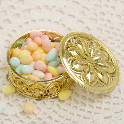 China Europe Plating Hollow Out Lid Plastic Design Around Wedding Favor Candy Box With Gold And Silver Color for sale