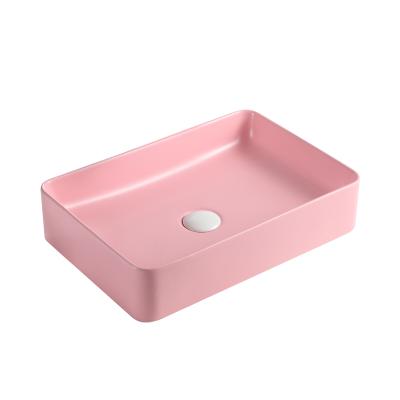 China Shampoo sinks high quality ceramic color designer table top washbasin for sale