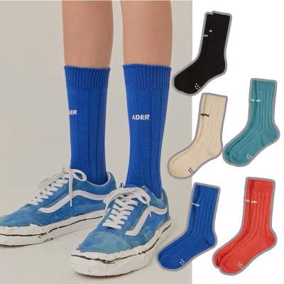 China QUICK DRY Unisex Embroidered Letters Socks Autumn Fashion Pure Color Breathable Cotton Wool Casual Socks for sale