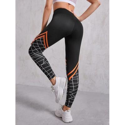 China Black Hot Breathable Unique Breathable Sports High Waist Printing Pants Girls Yoga Lift Panties With Pockets for sale