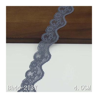 China Eco - Friendly Gray Daisy Floral Scallop Sided Narrow Stretch Lace for sale