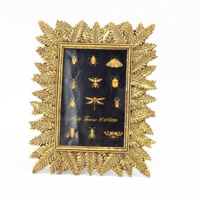 China Fashionable Wholesale Luxury Polyresin Factory Price Gold Photo Frames for sale