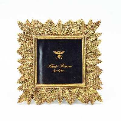 China Hot Selling Golden Modern Polyresin Picture Beautiful Decorative Polyresin Photo Frames for sale