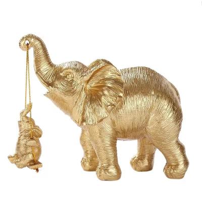 China Europe For Parents Gifts Souvenir Sculpture Mother Animal Elephant Takes Baby Elephant On A Swing Gold Resin Elephant Statue for sale