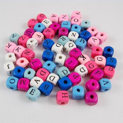 China Wooden Beads Open Dies Colorful Wooden Letter Die Cut Wooden Beads With Letters With Hole for sale