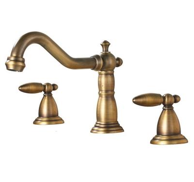 China Gold Bathroom Faucets Double Basin Sink Faucet Handle Three Holes Deck Mounted Hot And Cold Water Swan Crystal Mixer Tap for sale