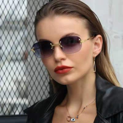 China Hot Sale Male Luxury Rimless Blue Frameless Sunglasses HBK 2021 Fashion Sunglasses Square Frame Sun Glass Retro for sale