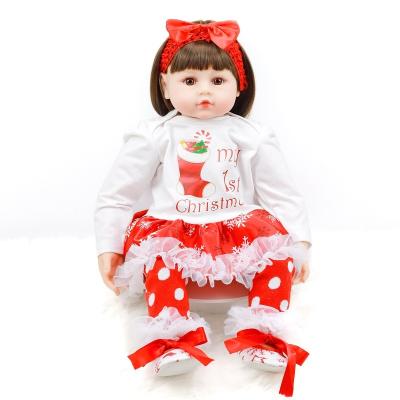 China Changeable Clothing Lifelike Soft Cuddly Weighted Cotton Cloth Body Vinyl Doll 24 Inch Custom Manufacturer for sale