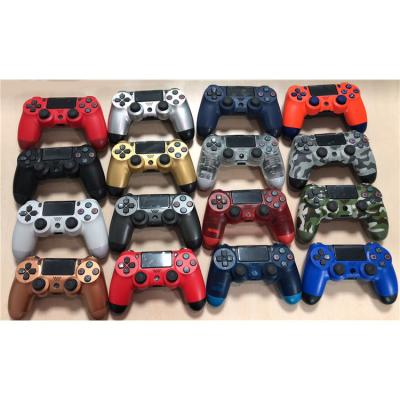 China With Handbreak Handle Wireless Gamepad With Light Guide Vibration Game Controller Handle For Ps 4 Gamepad for sale