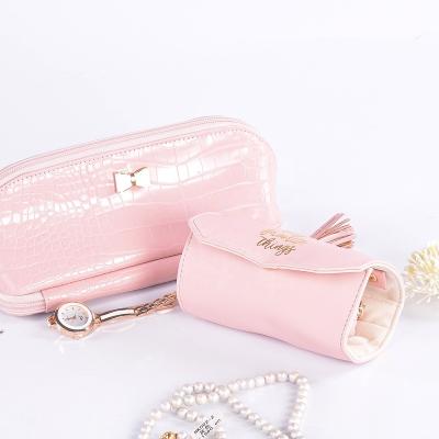 China Handmade Pink Jewelry Roll Bag Custom Luxury Fancy With Tassel For Travel for sale