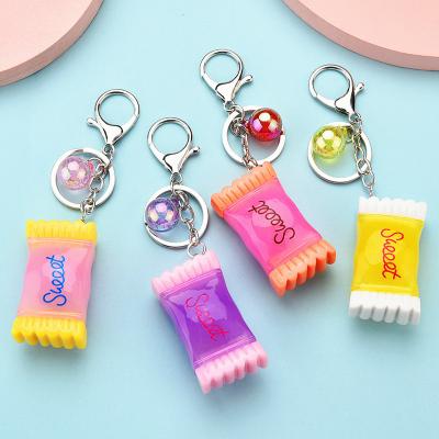 China Custom Resin Luminous Cute Design Mini Acrylic Keychain For Women Fashional Souvenir Gifts Candy Bag Key Chain for sale