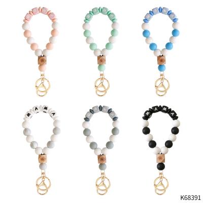 China New Handmade Beaded Key Ring Jewelry Portable Custom Women's Keychains Bracelet Bangle Silicone Wristband for sale