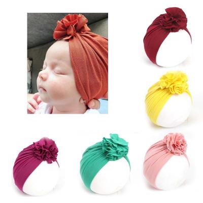 China New Baby Unisex Warm Doudou Bowknot Cotton Dobby Solid Color Dobby Parent-child Indian Knitted Hat for sale