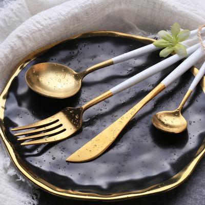 China Sustainable Luxury Wedding Knives And Spoon Gold Fork Set Stainless Steel Cutlery Set With White Handle Flatware Set Stainless for sale