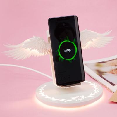 China UniversalÂ   In Running Angel Wings With LED Light 10W Desktop Wireless Charger Vertical For Apple And Android Mobile Phones for sale