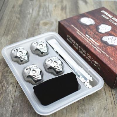 China Amazon Sales Promotion Stainless Steel Viable Hot Selling Skulls Shaped Cooling Stone With Tongs for sale