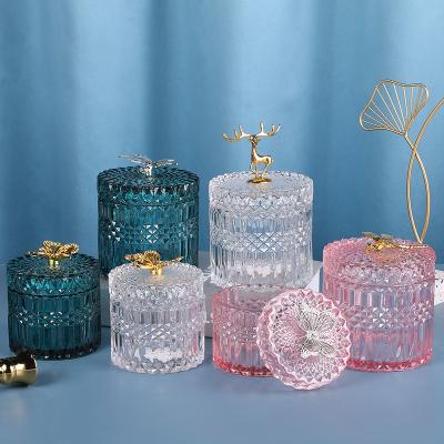 China Geo Decoration Embossed Texured Sustainable Multiple Specification Colored Silver Gold Cut Storage Glass Candy Jars Container With Lid for sale