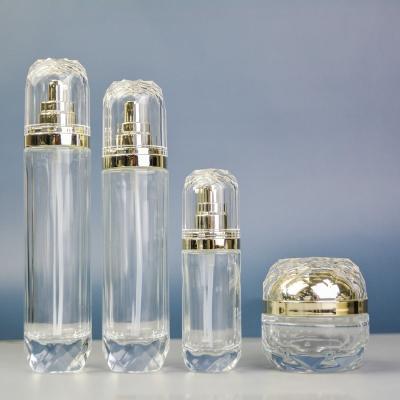 China Daily Life Custom Round Perfume Glass Perfume Bottle 30ml 50ml 100ml Empty Clear Glass Cosmetic Bottles With Cap B01 for sale