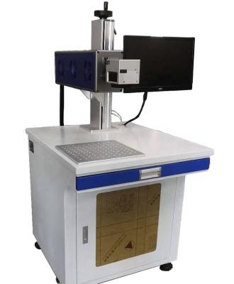 China Air-cooled QK-C40B 40W Carbon dioxide laser marking machine for cloth art and silicone products marking for sale