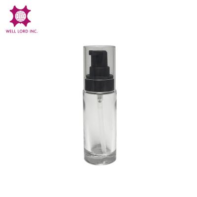 China Best Selling Item 35ml Cosmetic Cylinder Glass Bottle With Black Lotion Pump Skin Care Packaging for sale