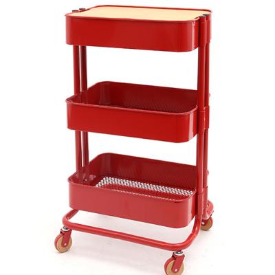 China Sustainable Metal Storage Rack With Wheels 3 Layers Organizer With Wooden Panel for sale