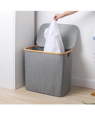 China 2022 minimalist new design large capacity laundry basket high quality bamboo basket with lid and handle for sale