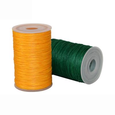 China Abrasion-Resistant 0.45mm 0.55mm 0.65mm Light Yellow Polyester Thread Nylon Bonded Waxed Thread For Sewing Leather for sale