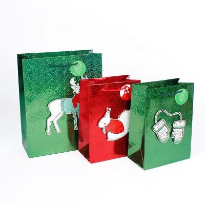 China Top Selling Colorful Printing 3D Tip Recyclable On Christmas Gift Bags Paper With Holographic Foil Lamination for sale