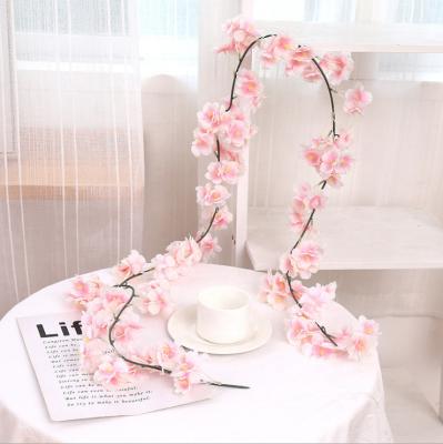 China Hot Sale Indoor Wedding Party Decoration Cherry Blossom Plastic Artificial Flowers Silk Vine and Party Decoration for Christmas for sale