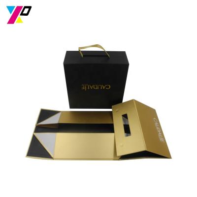 China New Professional Creative Recyclable Suitcase Black Gift Folding Box By Magnetic Ribbon Handle Closures for sale