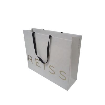 China Custom Concise Recyclable Eco Friendly Reusable Hot Sale White Paper Foldable Fashion Gift Packing Shopping Bag for sale