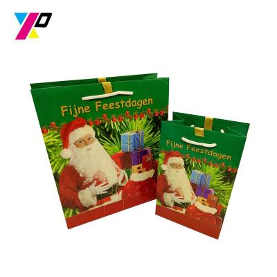 China Recyclable Wholesale Hot Sale Christmas Sack Drawstring Gift Bags Printed Paper for sale