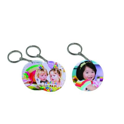 China 43mm Polymer Fashion Key Chains New Arrival Customized Environmentally Friendly Hanging Sublimation Round Key Chain for sale