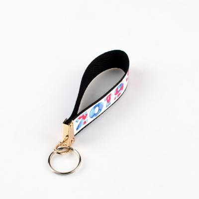 China Quality Price Souvenir Guaranteed Appropriate Sublimation Masks Fabric Band Tag Key Chain With Metal Keyring for sale