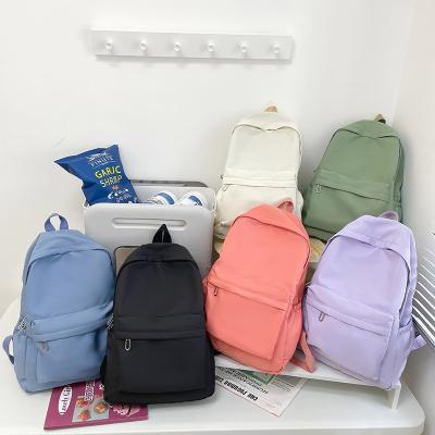 China Waterproof Cross Border Stylish School Bags Solid Color Large Capacity Nylon School Backpack for sale