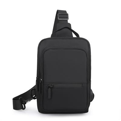 China Waterproof Most Popular Travel Outdoor Sling Bag Solid Color Large Capacity Men's Chest Bag with USB Charging Port for sale