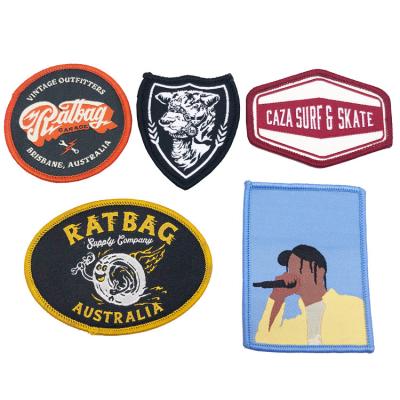 China Viable Custom Woven Patch Form Logo Woven Garment Patch With Merrow Border for sale