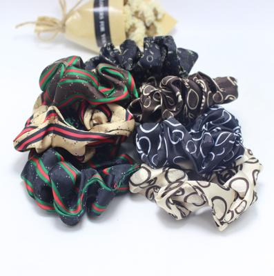 China Fashion style elastic hair scrunchies of European and American classic popular brand hair scrunchies for sale