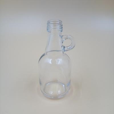 China Beverage Manufacturer Factory Price Wholesale Clear California Glass Bottle Mini Liquor Bottle With Handle 55ml1307 for sale