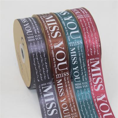 China Viable Custom 2.5cm Embossed Silk Ribbon Gift Flower Wrapping Paper Ribbon Printed English Ribbon Gift Color Wrapping Tape for sale