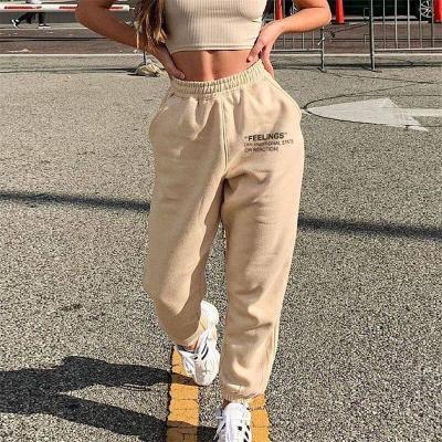 China Women's anti-static casual fashionable sports solid letters printed plus size high elastic tie feet loose pants long waist pants for sale