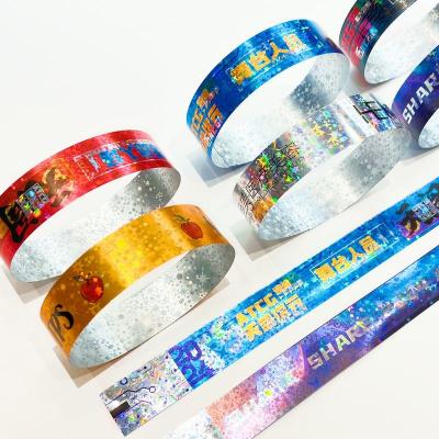 China Hot Sale Shiny Laser Glitter Promotional Wristband Waterproof Laser Paper Bracelet Adult Kid Events Admission Wristband for sale