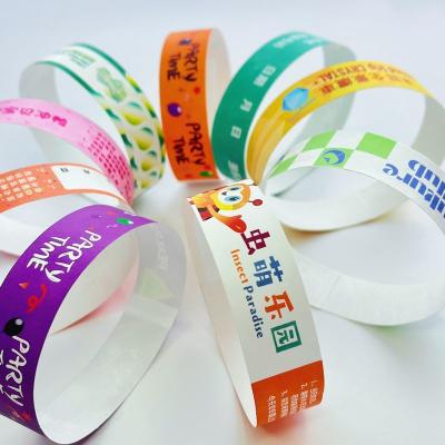 China Cheap Adjustable Tyvek Event Wristbands Scan The Barcode Events Variety Of Colors Paper Event Bracelet for sale