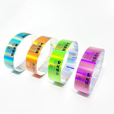 China Factory Wholesale Laser Glitter Wrist Strap Neon Color Ranibow Laser Barcode Logo Shiny Laser Paper Wristband For Event for sale