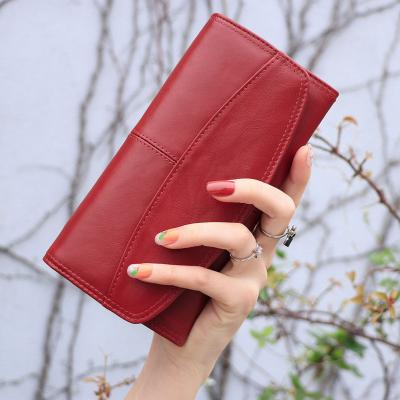 China HUMERPAUL Ladies Purses Anti-theft Genuine Leather Unique Card Holder Long Rfid Grab Latest Long Women Wallets for sale