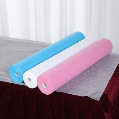 China Disposable Hot Selling Beauty Spa Salon Sauna Hospital Hotel Use 25gsm Pink Color Disposable Nonwoven Sheet Roll for sale