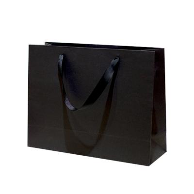 China Recycled Materials Black Cheap Custom Printed Biodegradable Paper Bag Packaging Gift Paper Boutique Bag for sale