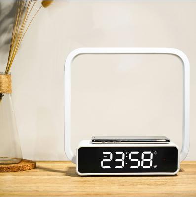 China New Design Bedside Modern Radio Sensor Touch Table Fill Lamp Led With Alarm Led Night Light Wireless Charger For Phone for sale