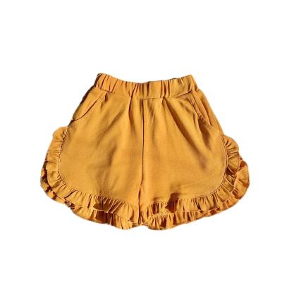 China 2023 springs QUICK DRY summer hotselling popular children's babies solid color ruffles pants loose lace up shorts for sale